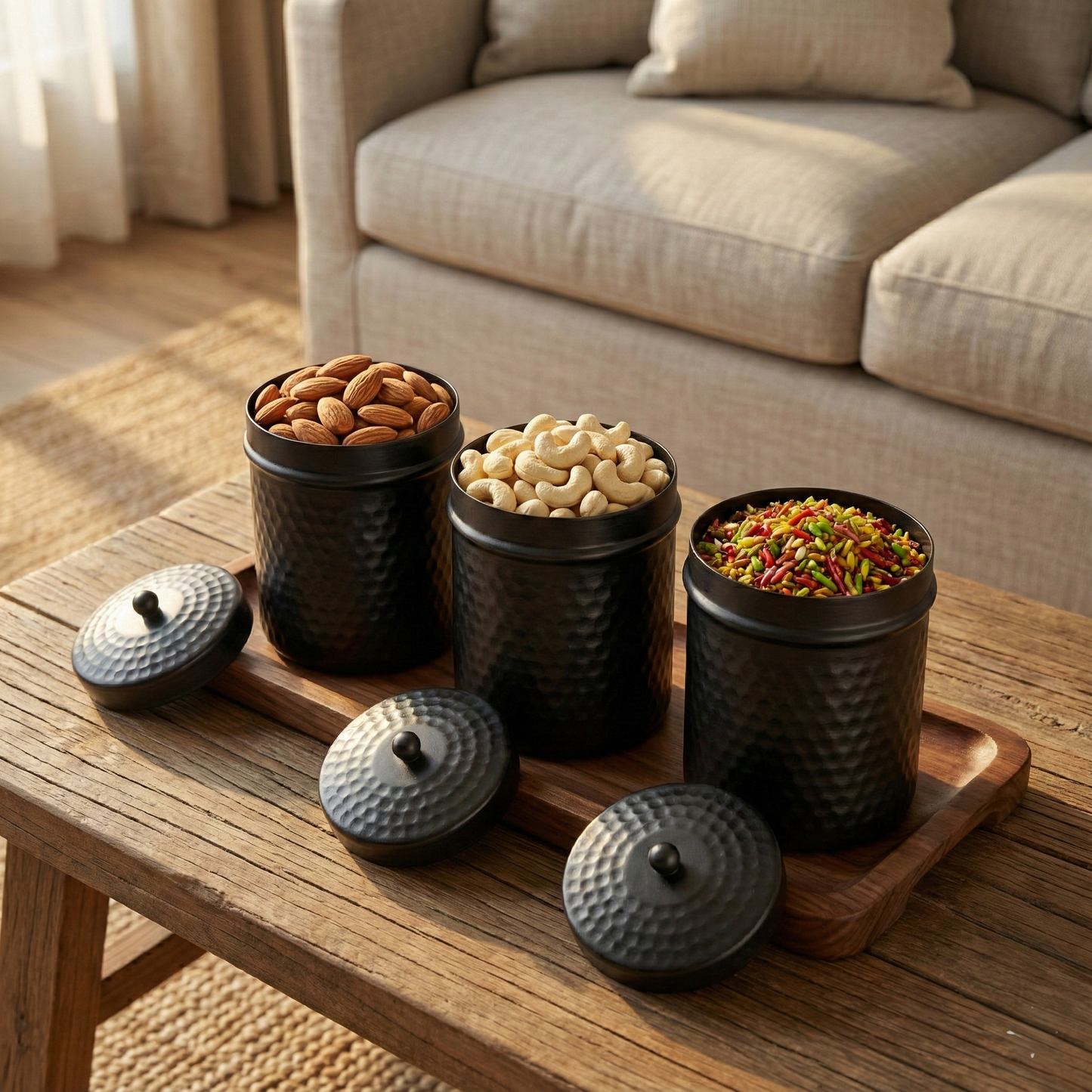 PreYog Matte Black Iron Serving Jars (Set of 3) with Dry Fruits on Wooden Tray for Premium Gift Decor.
